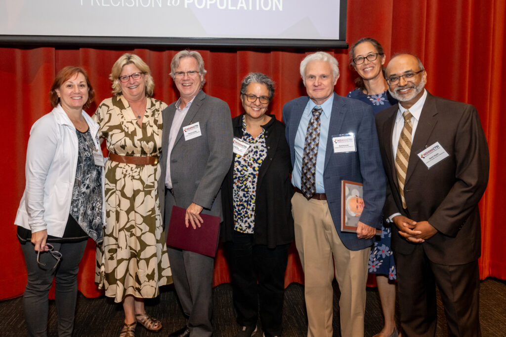 Dr. Kurt Kroenke poses alongside other leaders in the Indiana CTSI.