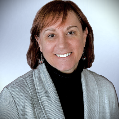 Tammy Sajdyk smiles in her headshot.