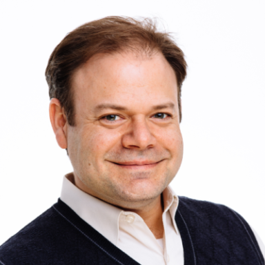 Tommy Sors smiles in his headshot.