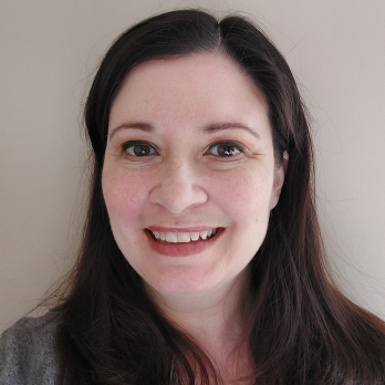 Ellen Ireland smiles in her headshot.
