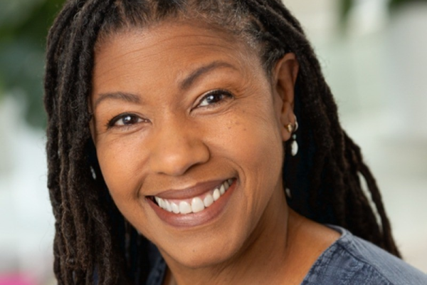 Kathi Ridley-Merriweather smiles in a headshot cropped to serve as a news story featured image.