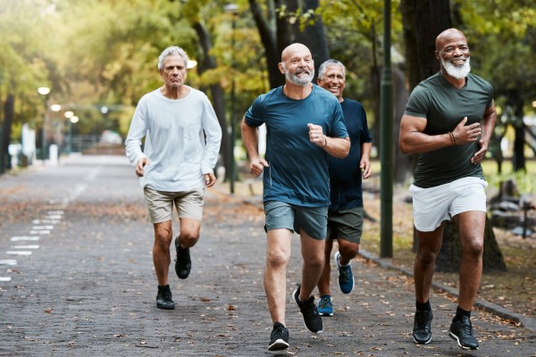 A diverse group of men on a run.