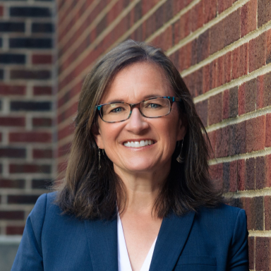 Laura Murray-Kolb smiles in her headshot.