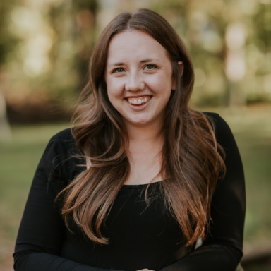 Emily Seiger smiles in her headshot.