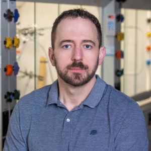 Matthew Webber smiles in his headshot.