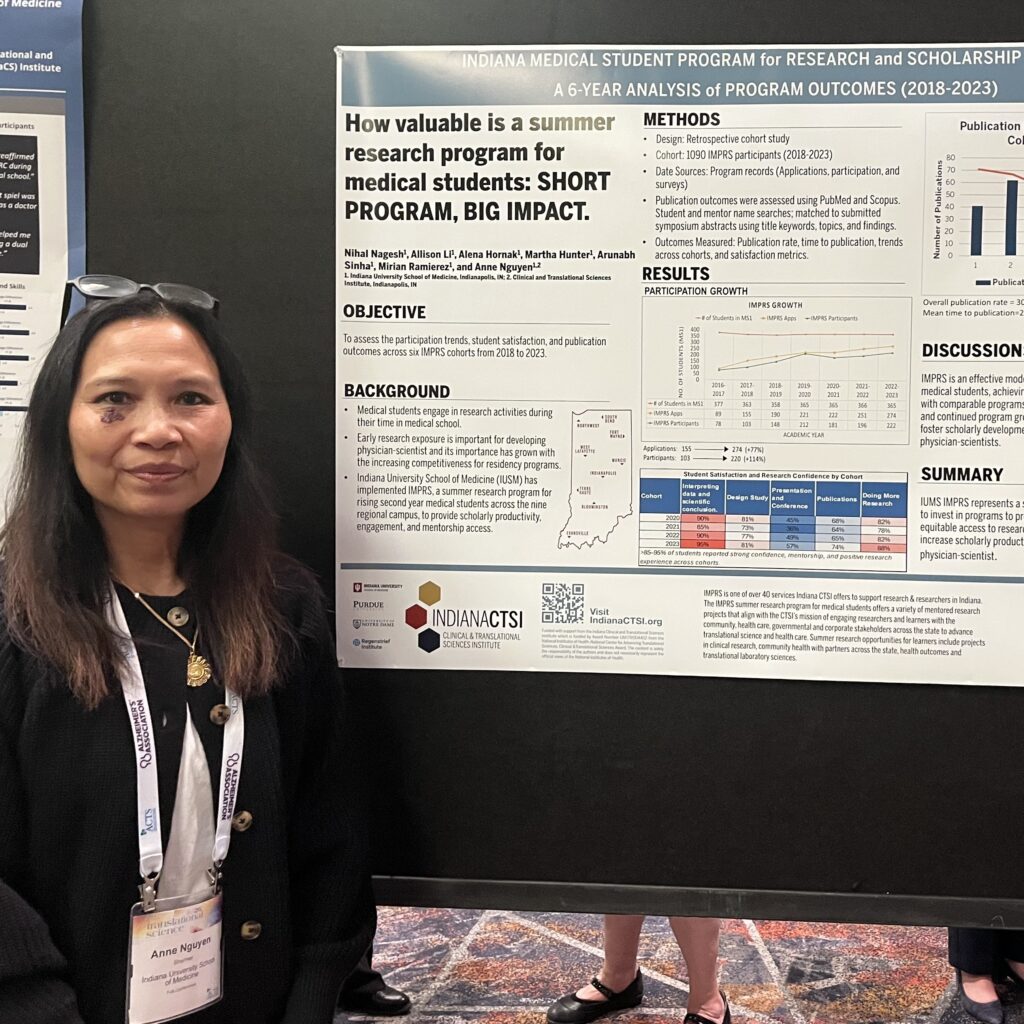Anne Nguyen in front of her poster.