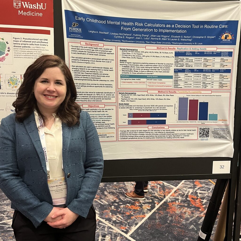 Leigha in front of her poster.