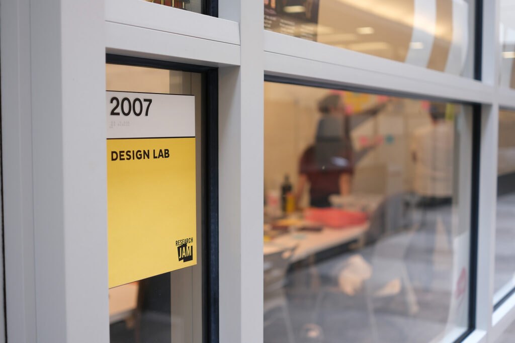 Viewing the team through the window of their workspace.