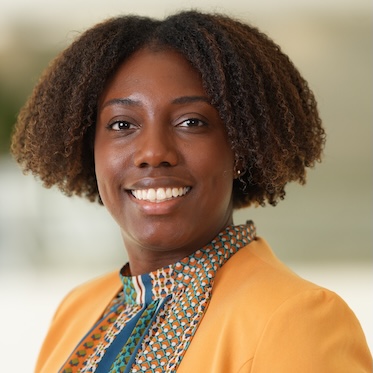 Sacha Sharp, PhD, smiles in her headshot.