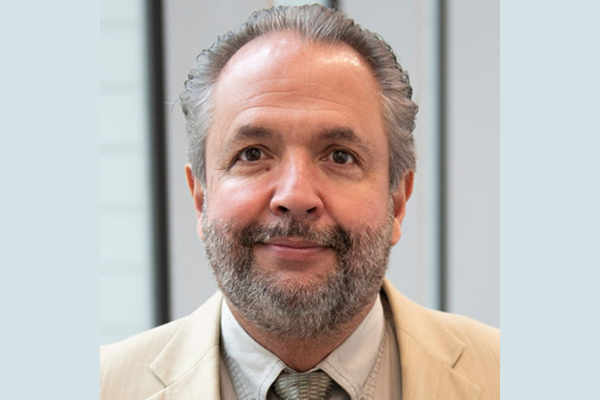 Gerardo Maupome headshot with gray background.