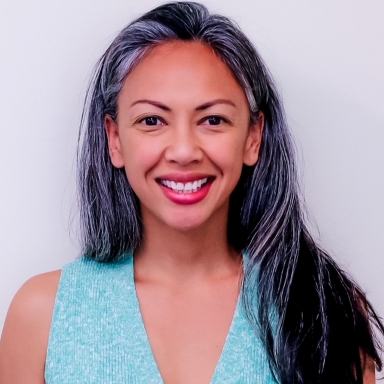 Melissa Pangelinan smiles in her headshot.