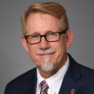 Bradley Allen smiles in his headshot.