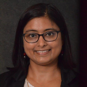 Priyanka Baloni smiles in her headshot.