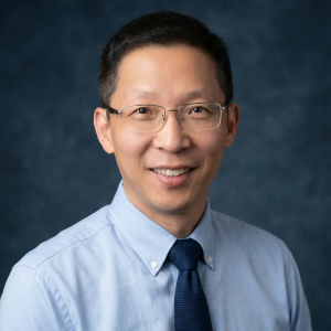 Renzhi Han smiles in his headshot.
