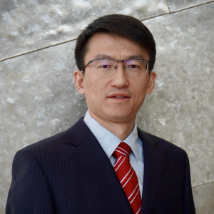 Ji Zhang smiles in his headshot.
