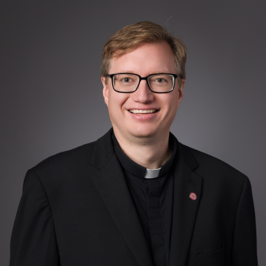 Bryan Paulsen smiles in his headshot.