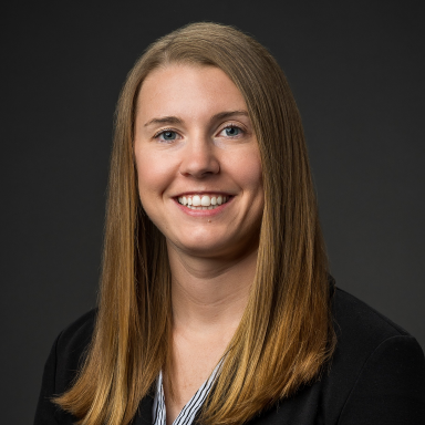 Ashley Giourdas smiles in her headshot.