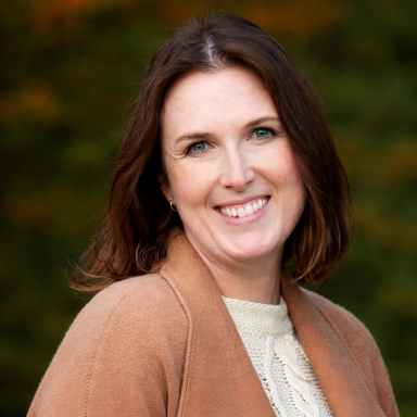 Maria Klein smiles in her headshot.