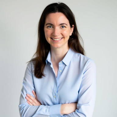 Diane Kuhn smiles in her headshot.