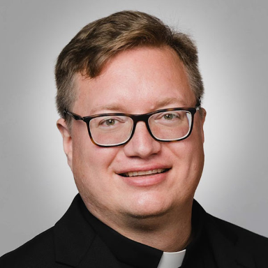 Bryan Paulsen smiles in his headshot.