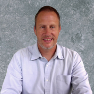 Brian Overholser smiles in his headshot