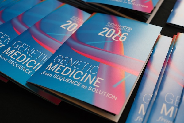 2026 Annual Meeting programs laid out on a table.