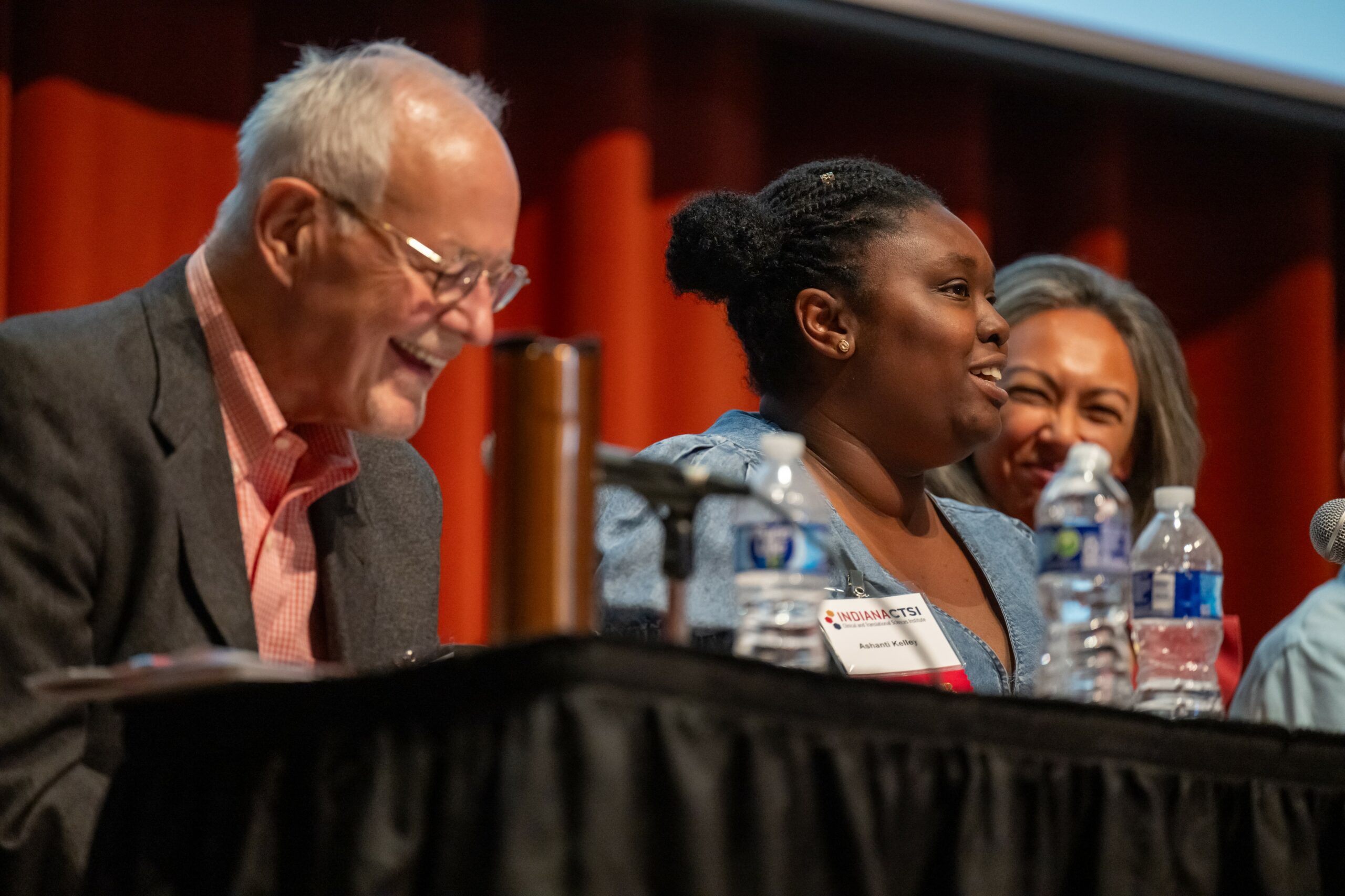 Community member Ashanti Kelly shares with the audience about her experience taking part in the Public Deliberation of Biobanks.