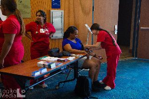 Audience member getting health screening