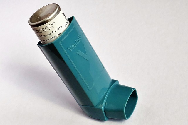 Image shows a blue inhaler against a white background