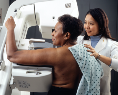 black woman undergoes mammogram