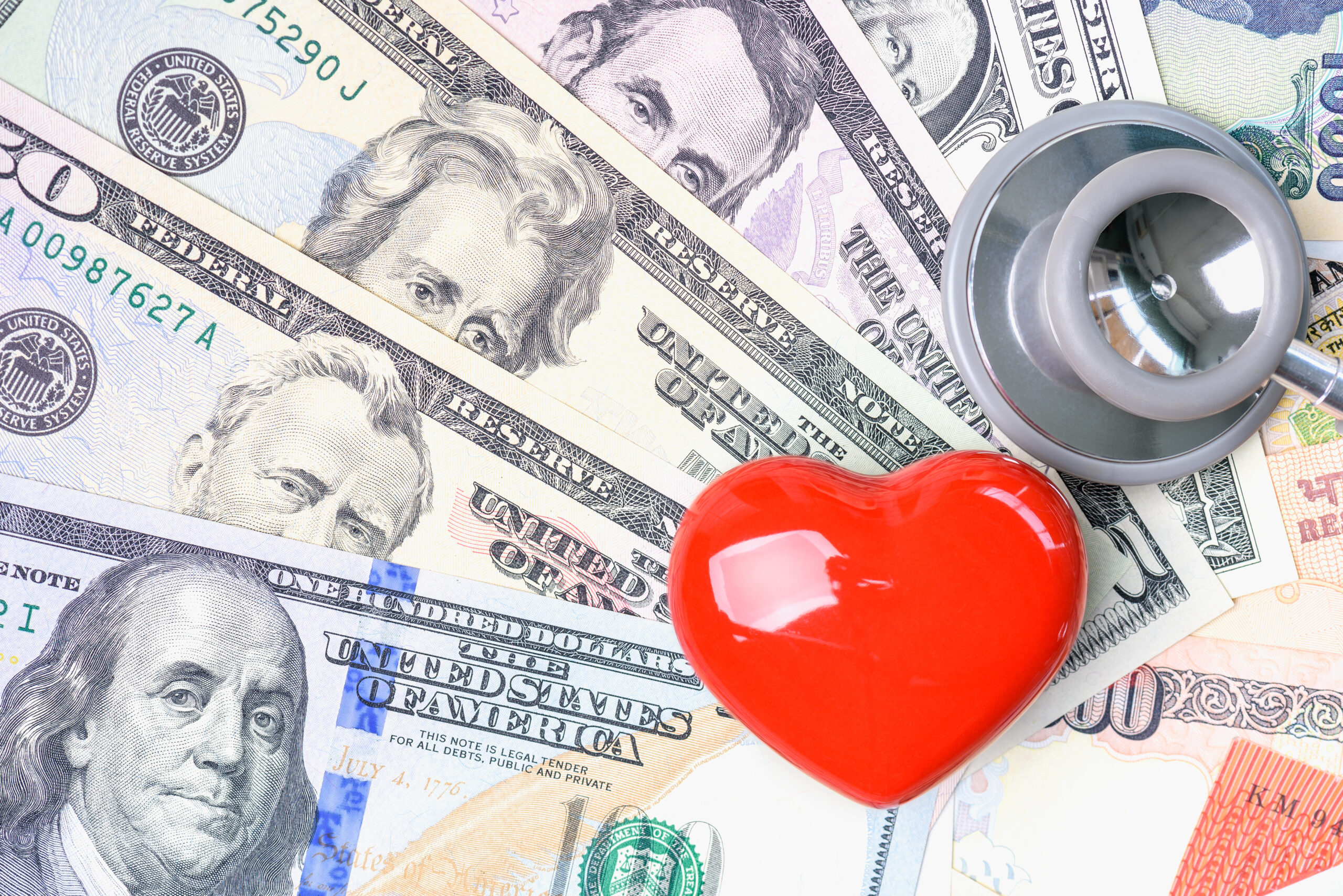 money with heart and stethoscope