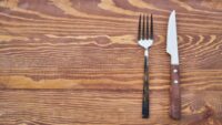 empty table with fork and knife